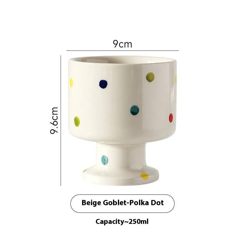 Hand-pinched irregular ceramic mug showing solid colour and unique shape
