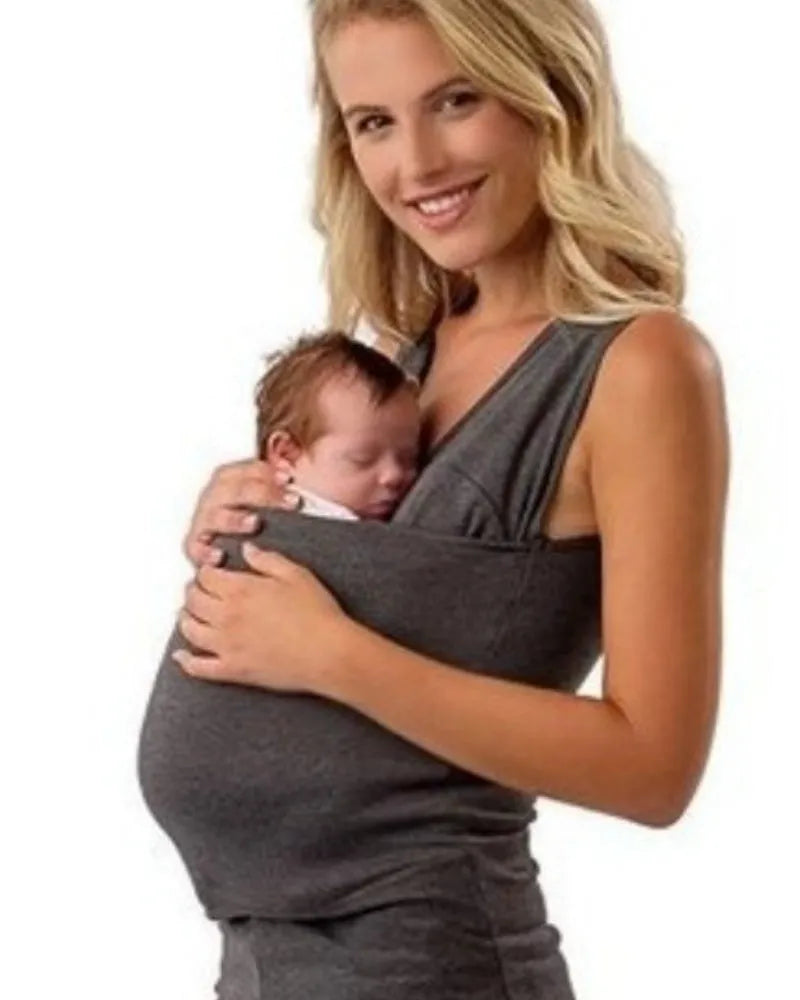 Loose fit green cotton casual top with round neck and short sleeves on a hanger.