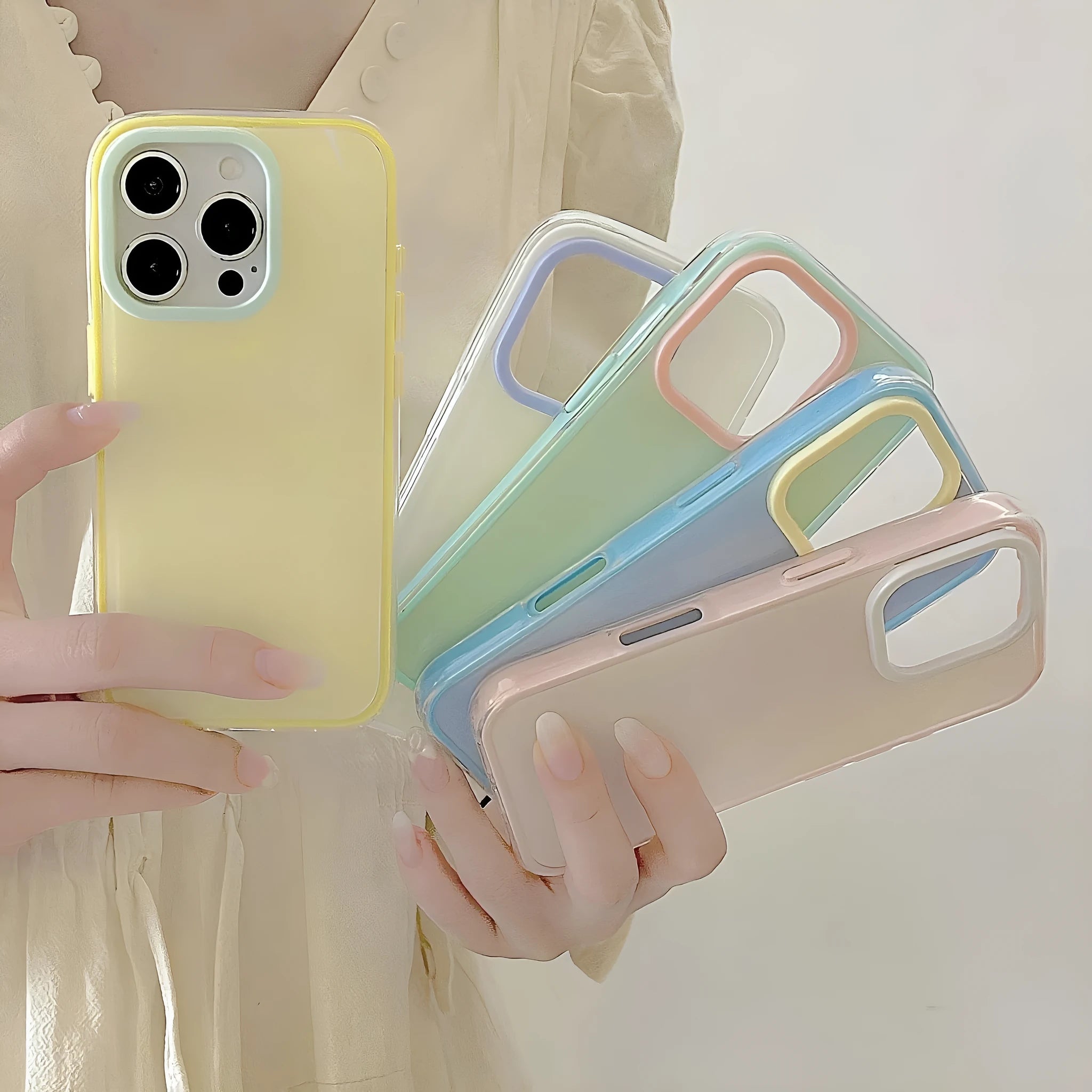 Simple solid colour jelly TPU phone case for iPhone, shown in blue, white, and yellow.