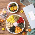 Box of honeysuckle chrysanthemum loose leaf herbal tea showing 150g net weight