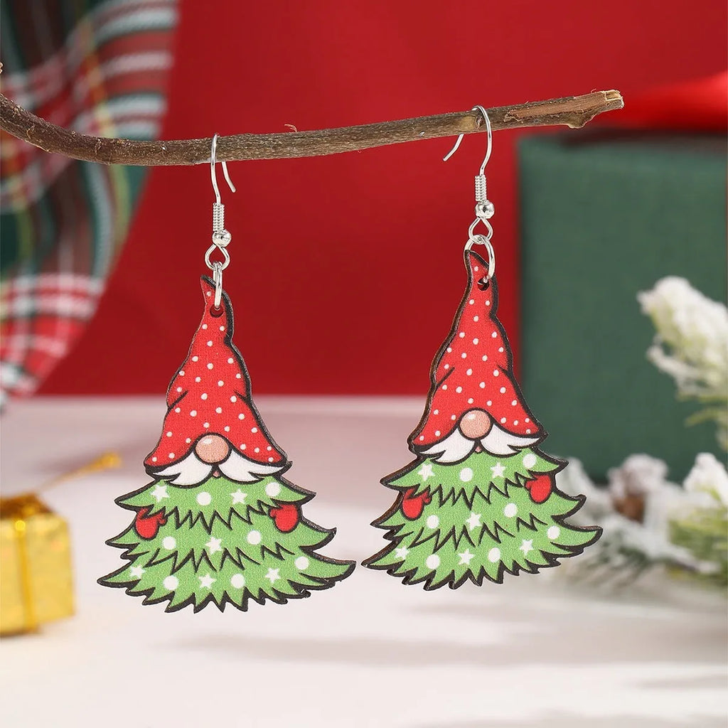 Wooden Christmas earrings with printed tree and snowman designs on geometric shapes