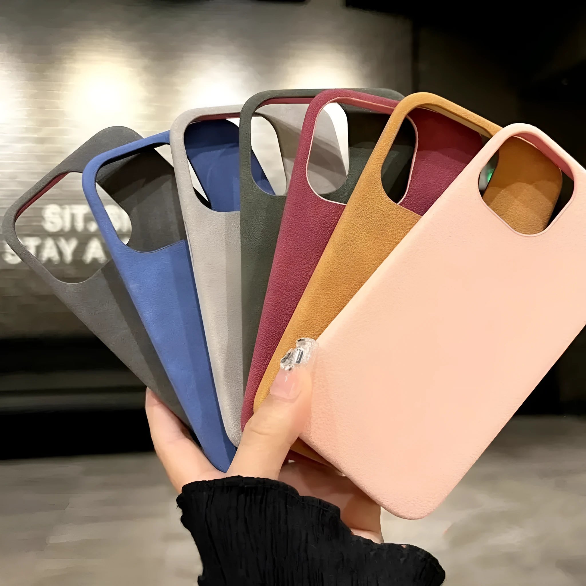 Solid colour suede imitation leather iPhone case in half-pack design showing shockproof protection features