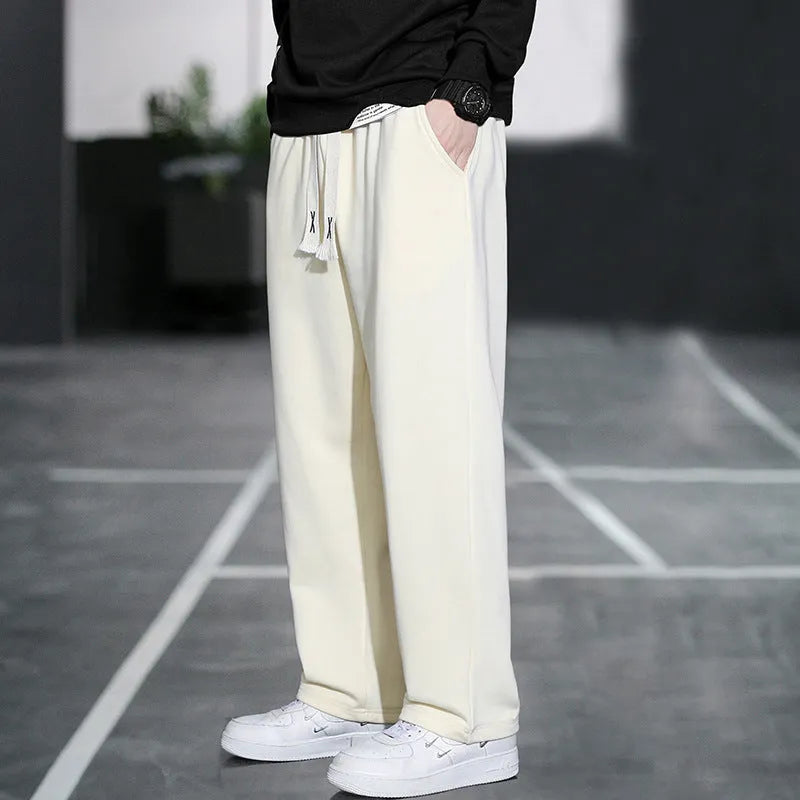 Casual grey men's sports trousers with multiple pockets and a high-waist design.