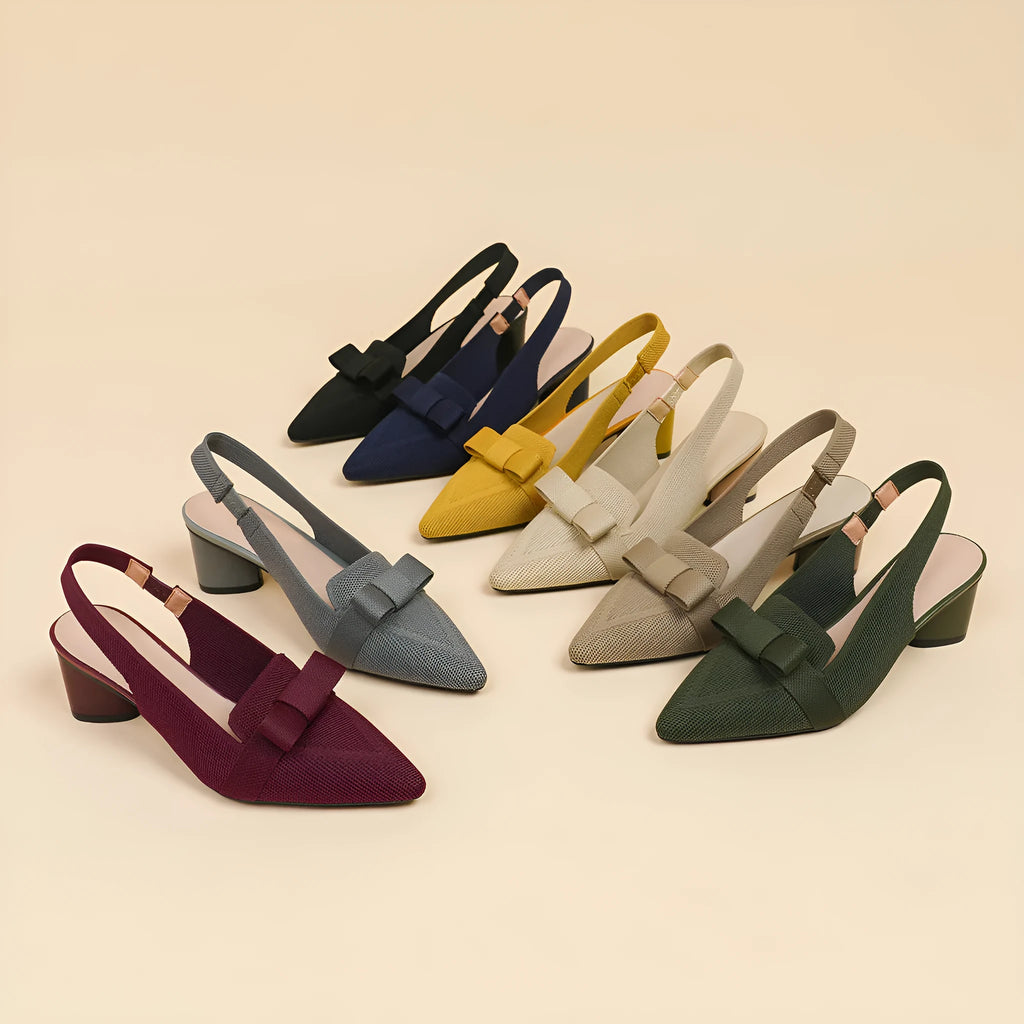 Women's closed toe high heel sandals with an ankle back strap in a pointed toe design on a rubber sole
