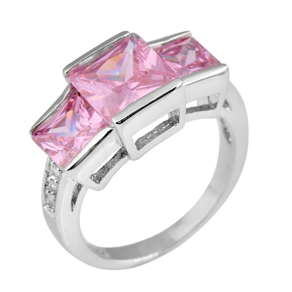 Geometric wholesale ring ornament in electroplated copper showing multiple colour options on a size 8 finger