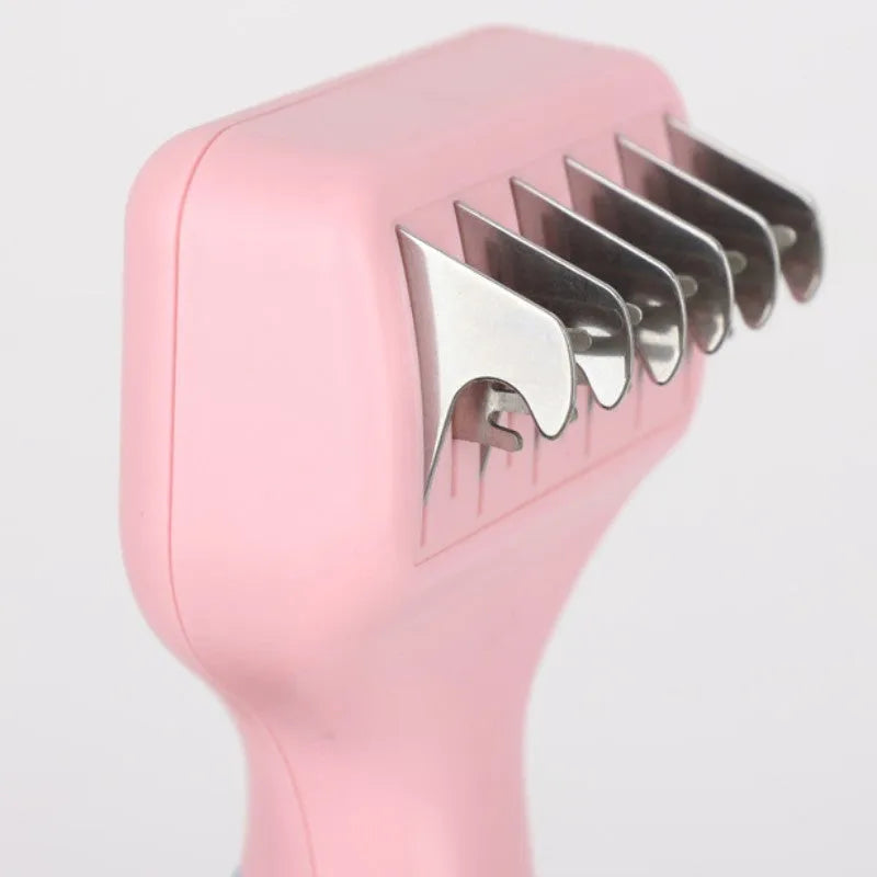 Pink stainless steel dog comb with integrated knot cutting blade for pet grooming
