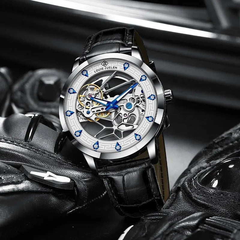 Men's silver case mechanical watch with white dial, blue hands, and a black leather strap.
