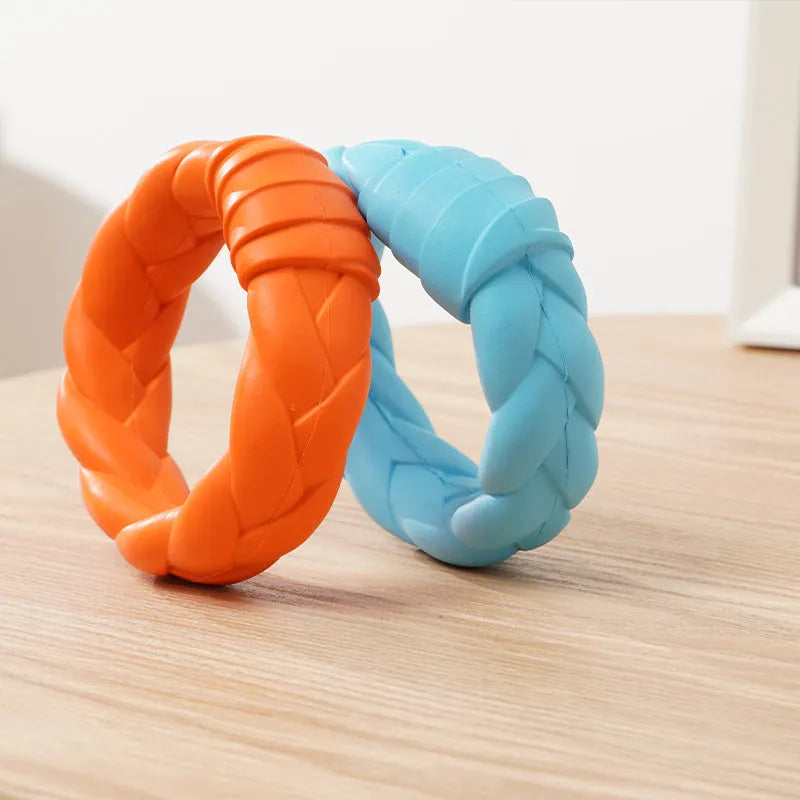 Blue rubber woven ring dog toy for teeth cleaning and interactive training on a plain background
