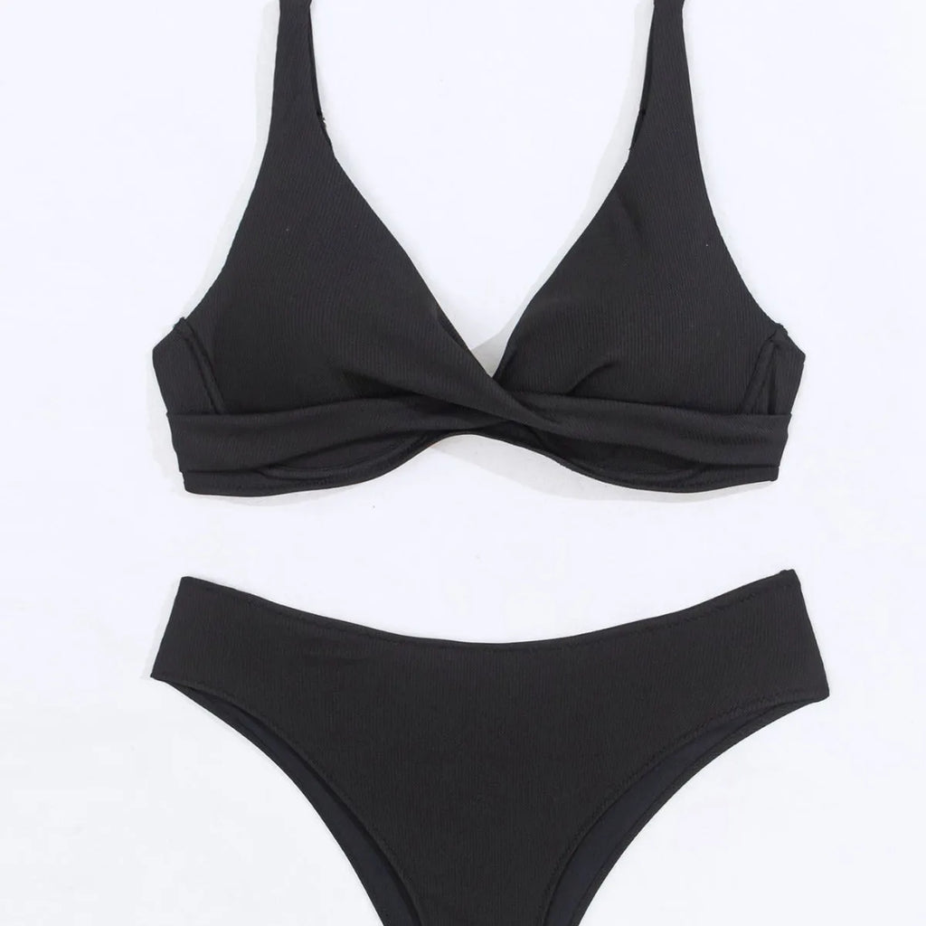 Women's solid colour ribbed fabric bikini swimsuit two-piece set on a hanger.