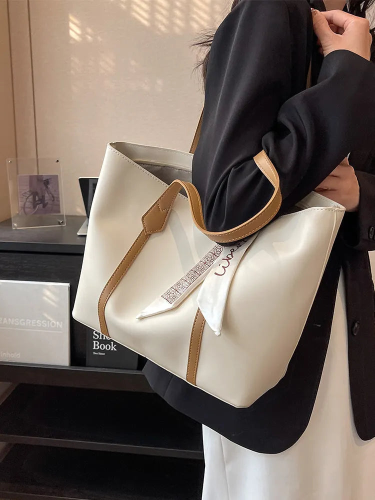 Large capacity bucket-style tote bag in multiple colour options with sandwich pocket exterior