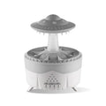 White cloud-shaped UFO raindrop humidifier with water mist and coloured lights