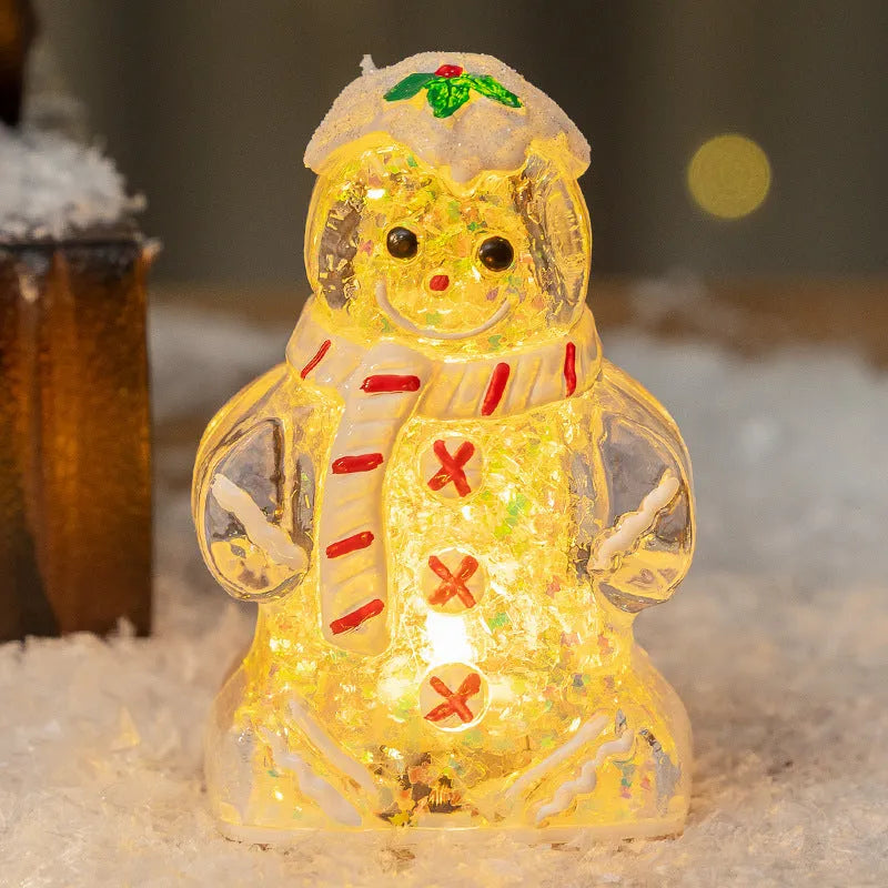 Glowing plastic gingerbread man snowman Christmas ornament with a choice of scarf colours on a festive background.