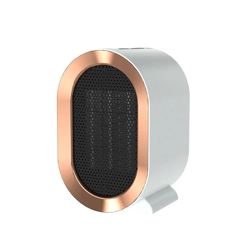 Desktop electric fan heater with black casing and UK plug, showing control knob and air vents