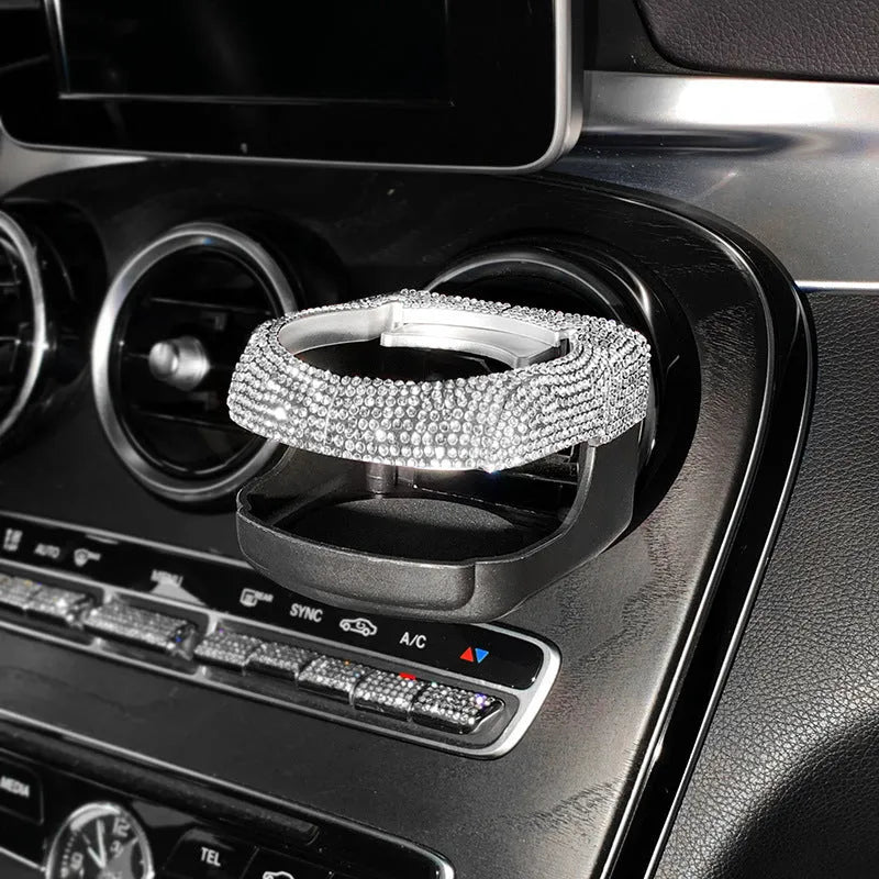 White diamond encrusted ABS plastic car cup holder mounted on a vehicle air vent.
