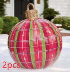 Large red and white striped inflatable Christmas ball ornament hanging on an outdoor tree