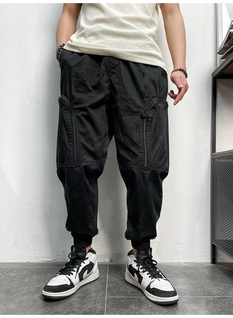 Men's loose fit cotton cargo trousers with elastic waist and zipper pockets in army green