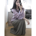 Purple women's blouse with hollow out design and princess sleeves on a hanger.
