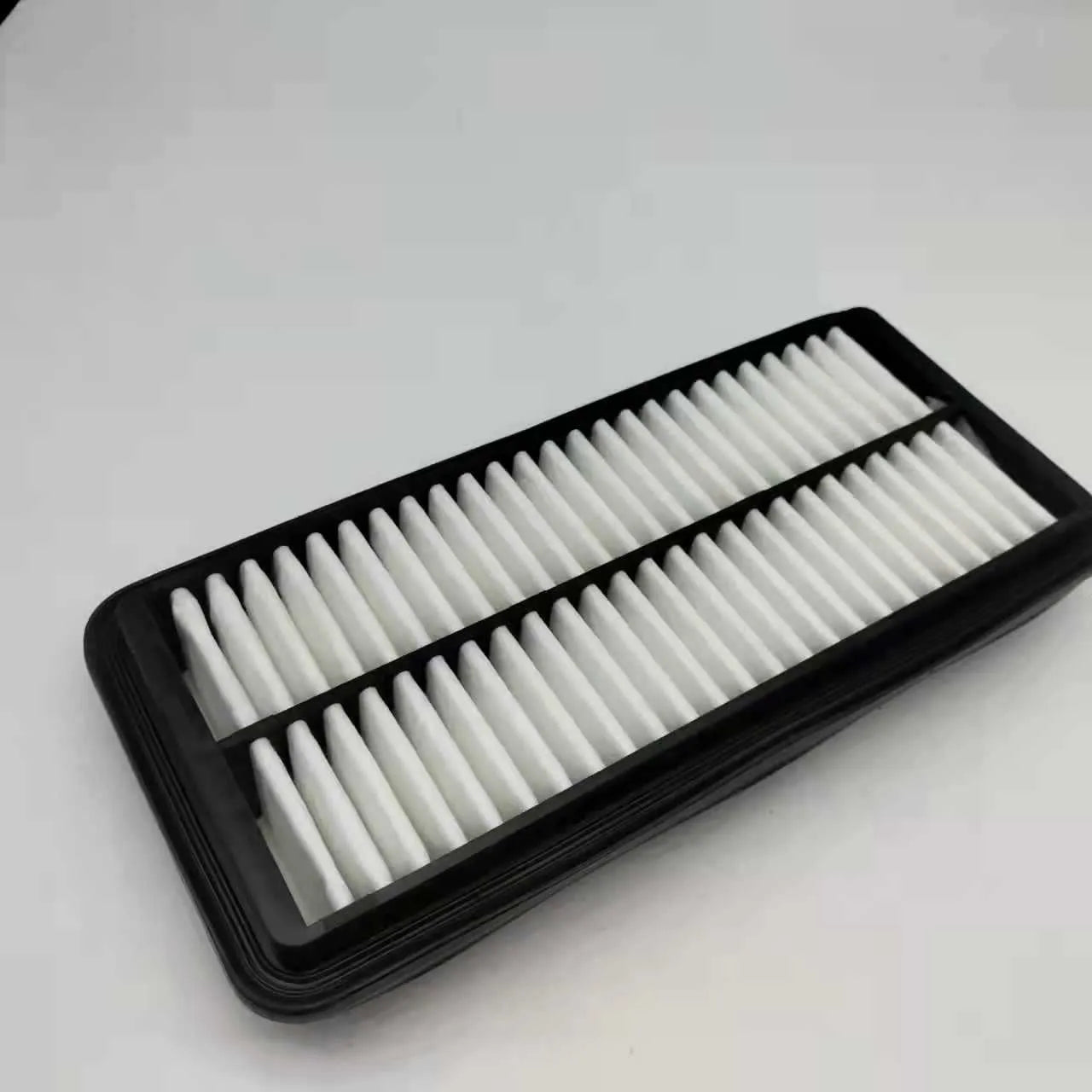 Black rectangular car air filter measuring 256mm by 113mm by 40mm dimensions