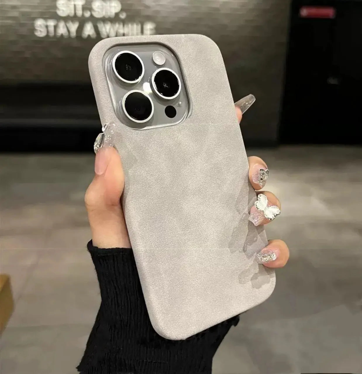 Solid colour suede imitation leather iPhone case in half-pack design showing shockproof protection features