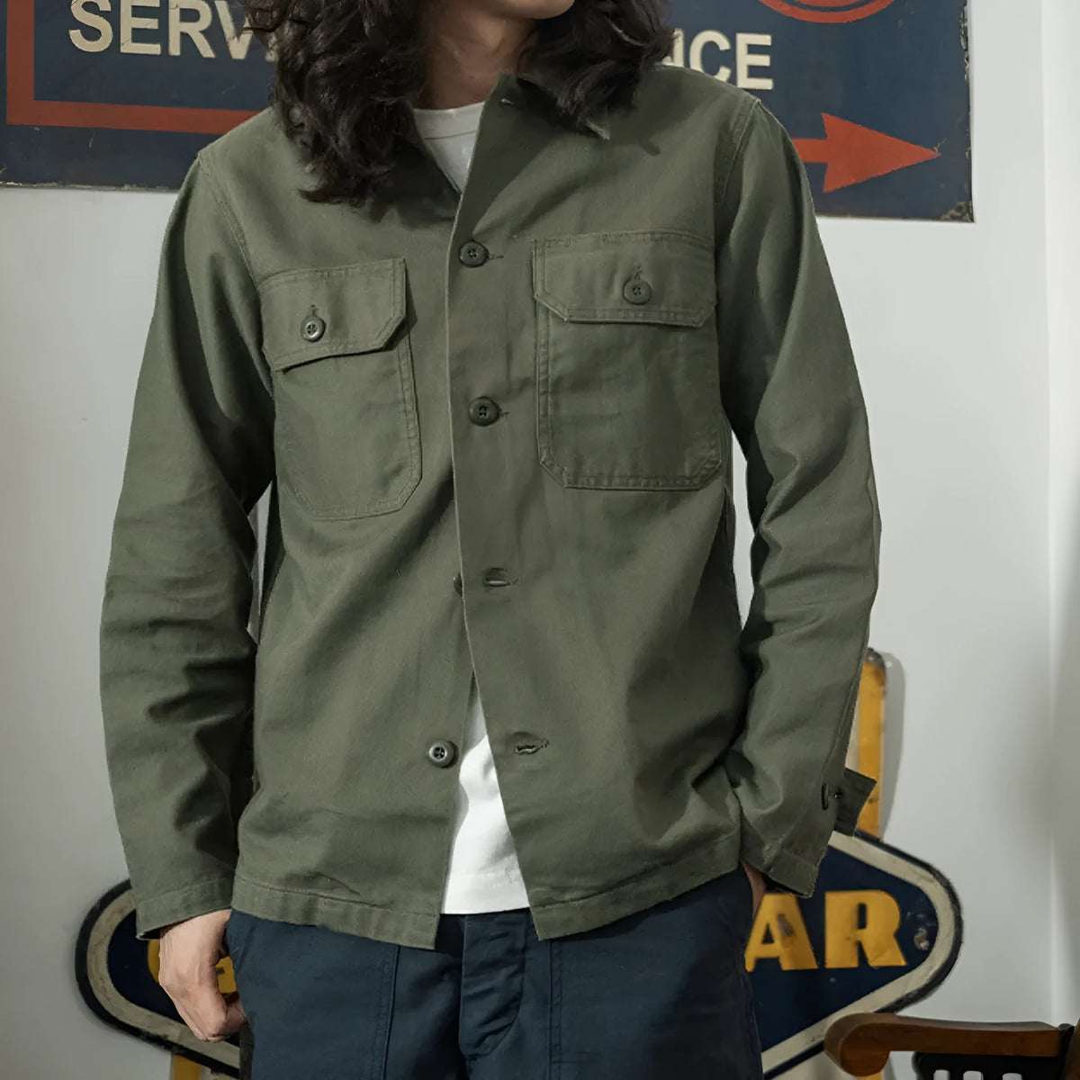 Olive green cotton satin men's work shirt with slim fit cardigan style on a white background