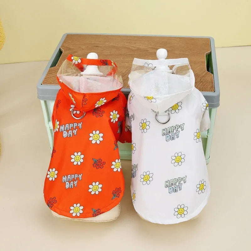Transparent dog raincoat with two feet coverage and pull ring closure in small flower pattern