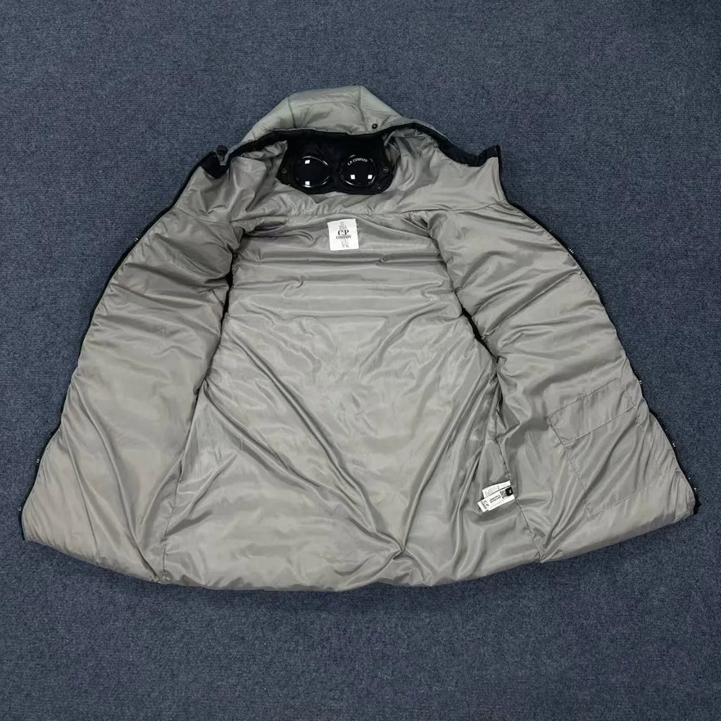 Men's loose hooded cotton vest jacket in black, side view, showing hood and zip closure