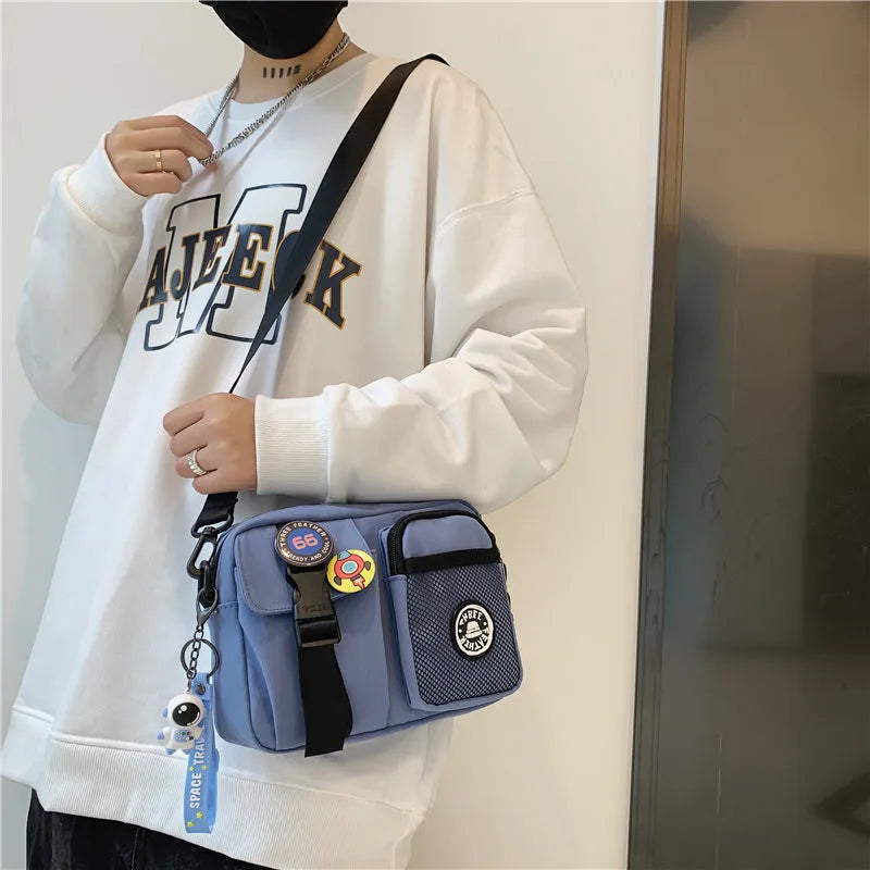 Casual nylon messenger bag for men women waterproof lightweight 22x6x17cm with badge pendants in beige black blue gray