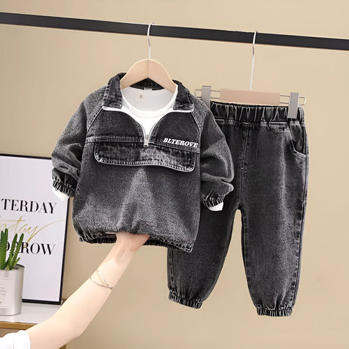Boy wearing a black denim two-piece suit set with long sleeves, Korean style.