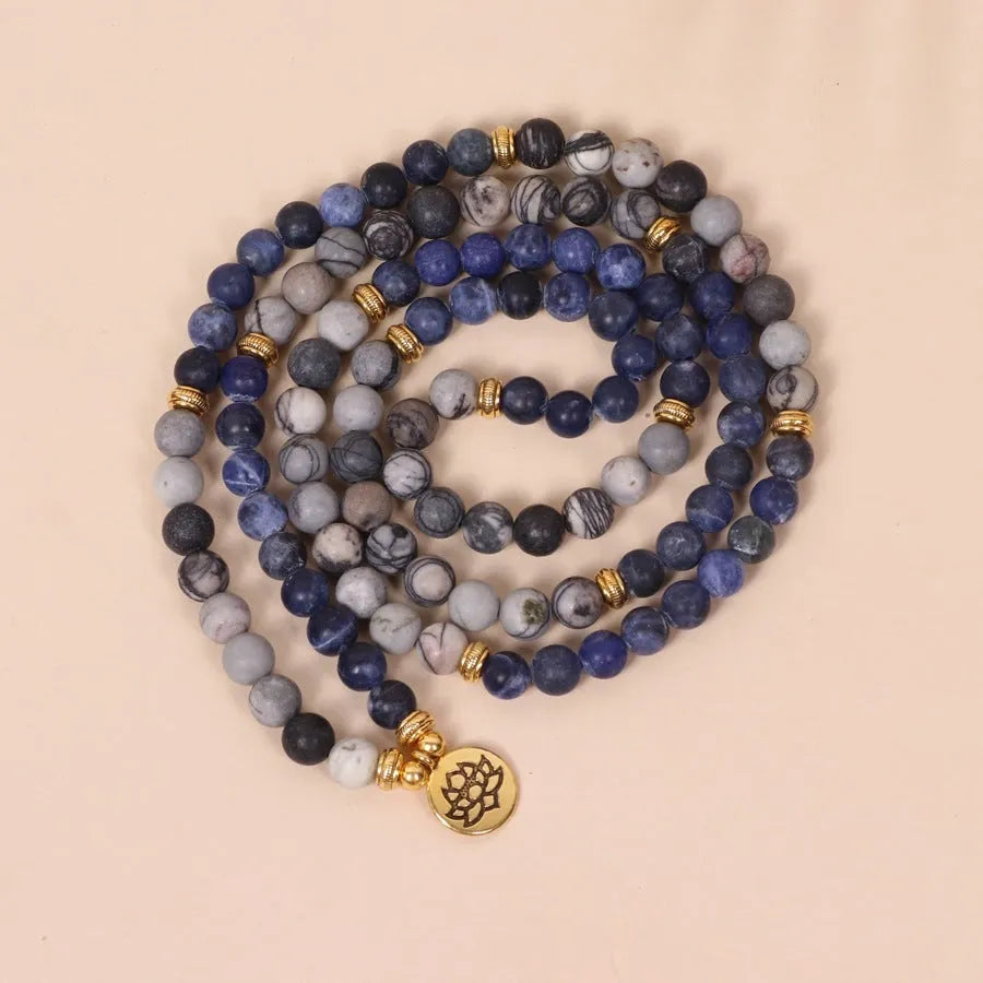 Blue multi-layer bracelet with patterned network stone beads on wrist