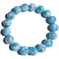 Blue Bodhi bracelet with natural sea-pattern crystal stones and pearl details in Maillard style.