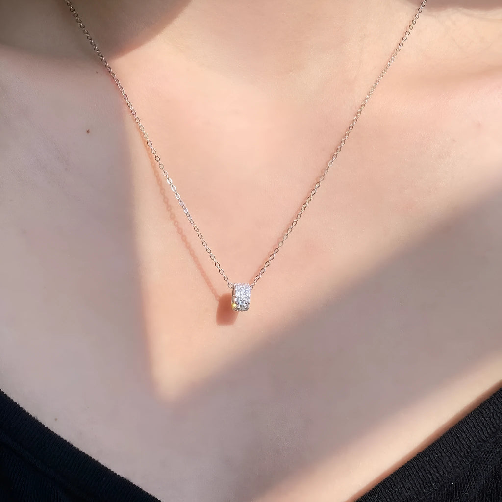 925 silver necklace with small waist pendant and platinum electroplate finish on white background