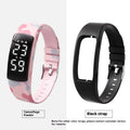 Waterproof vibration alarm watch with LED display and coloured silicone strap on a wrist.