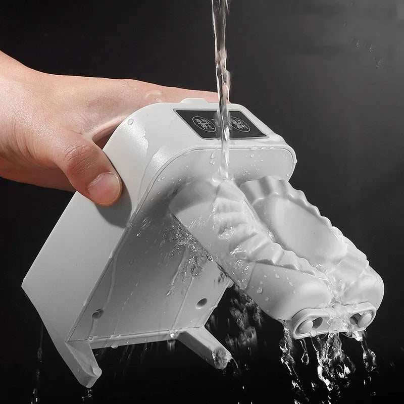 White automatic electric dumpling maker machine with charging cable, brush, and spoon.