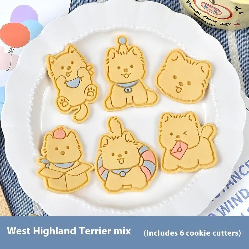 A 3D plastic biscuit mould showing raised puppy head, birthday hat, and dog cartoon designs.