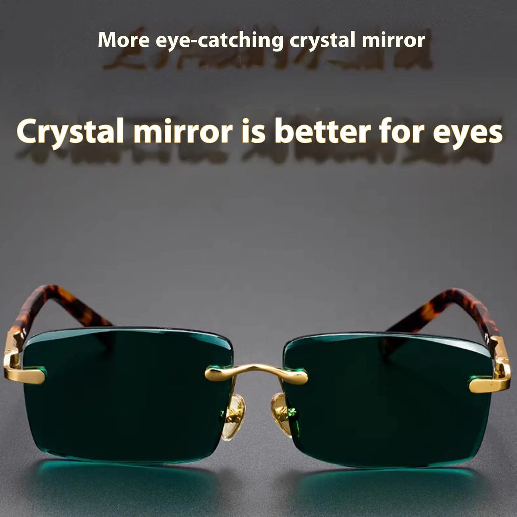 Dark green frameless crystal sunglasses inside a protective case with a lens cloth.