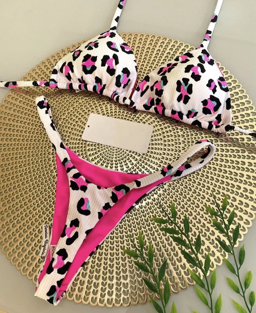 Women's printed nylon bikini with briefs style and cotton lining for swimming sports.