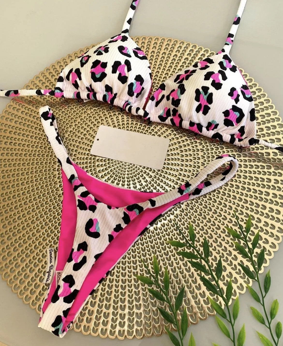 Women's printed nylon bikini with briefs style and cotton lining for swimming sports.