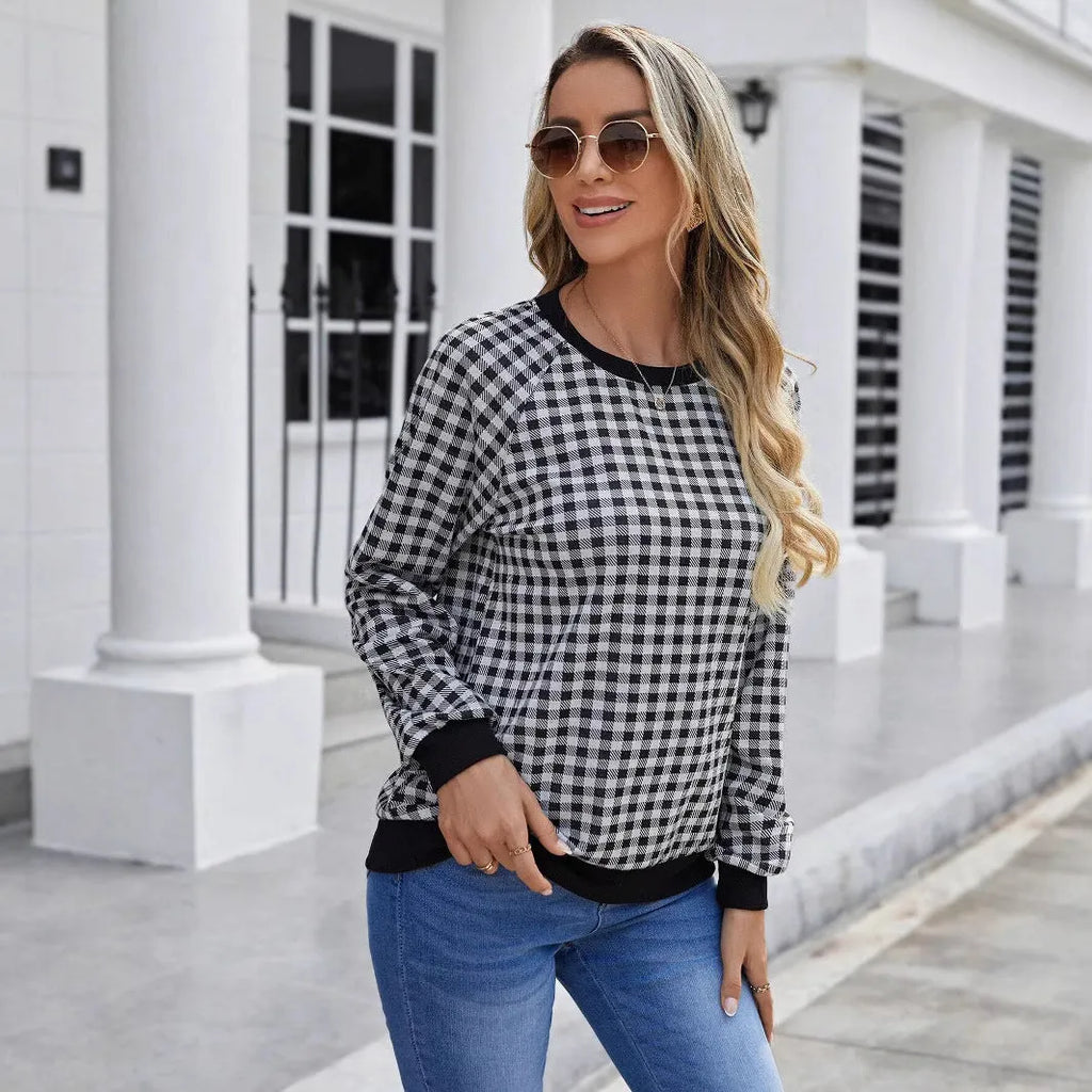 Black long sleeve pullover sweater with plaid and striped printed pattern