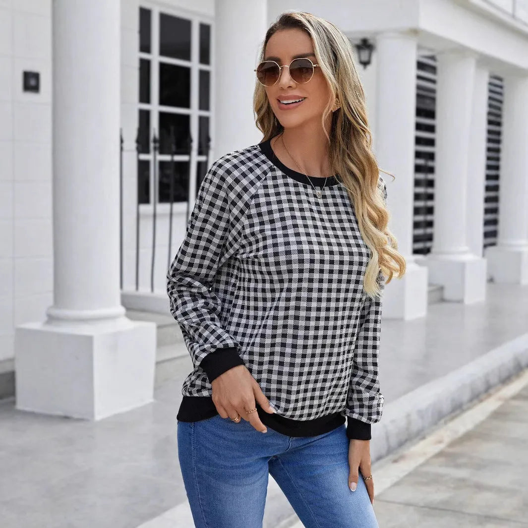 Black long sleeve pullover sweater with plaid and striped printed pattern