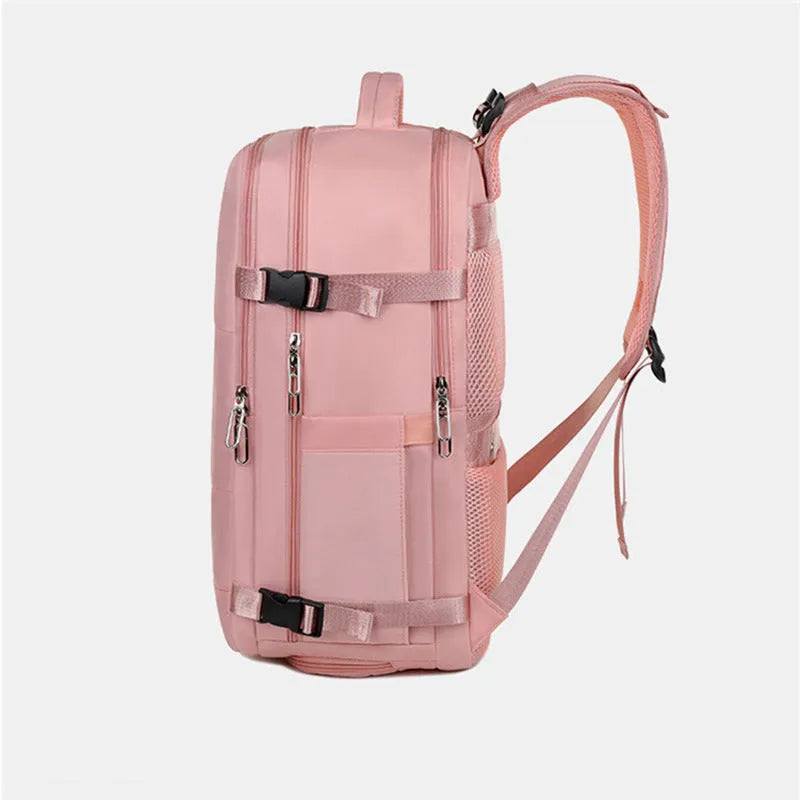 Large grey travel backpack for women with multiple compartments, shown open.