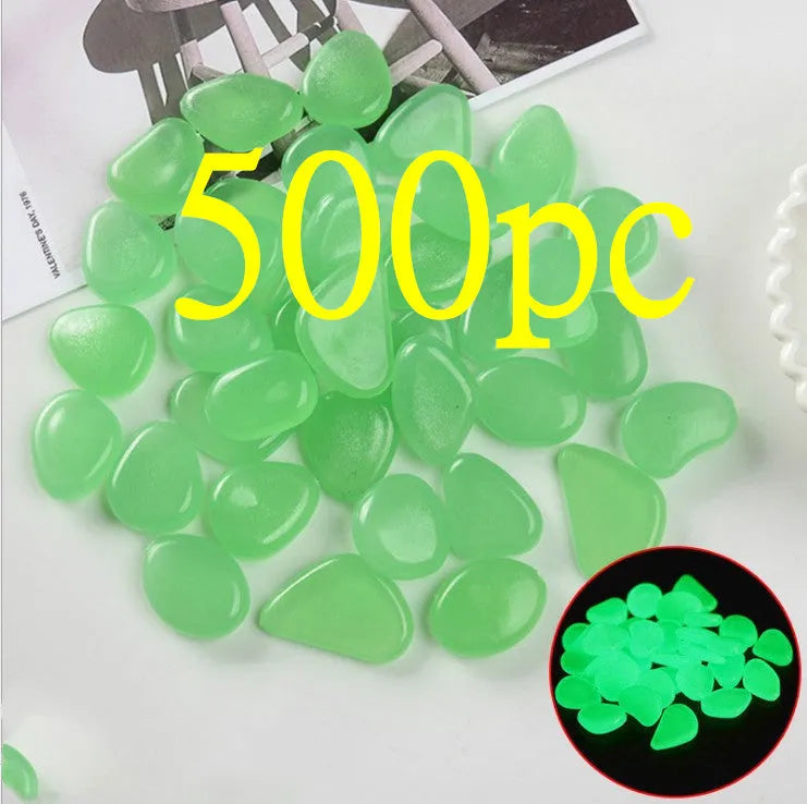 Luminous fluorescent aquarium and garden pebbles in mixed colours including dark purple, yellow, light blue, pink, orange