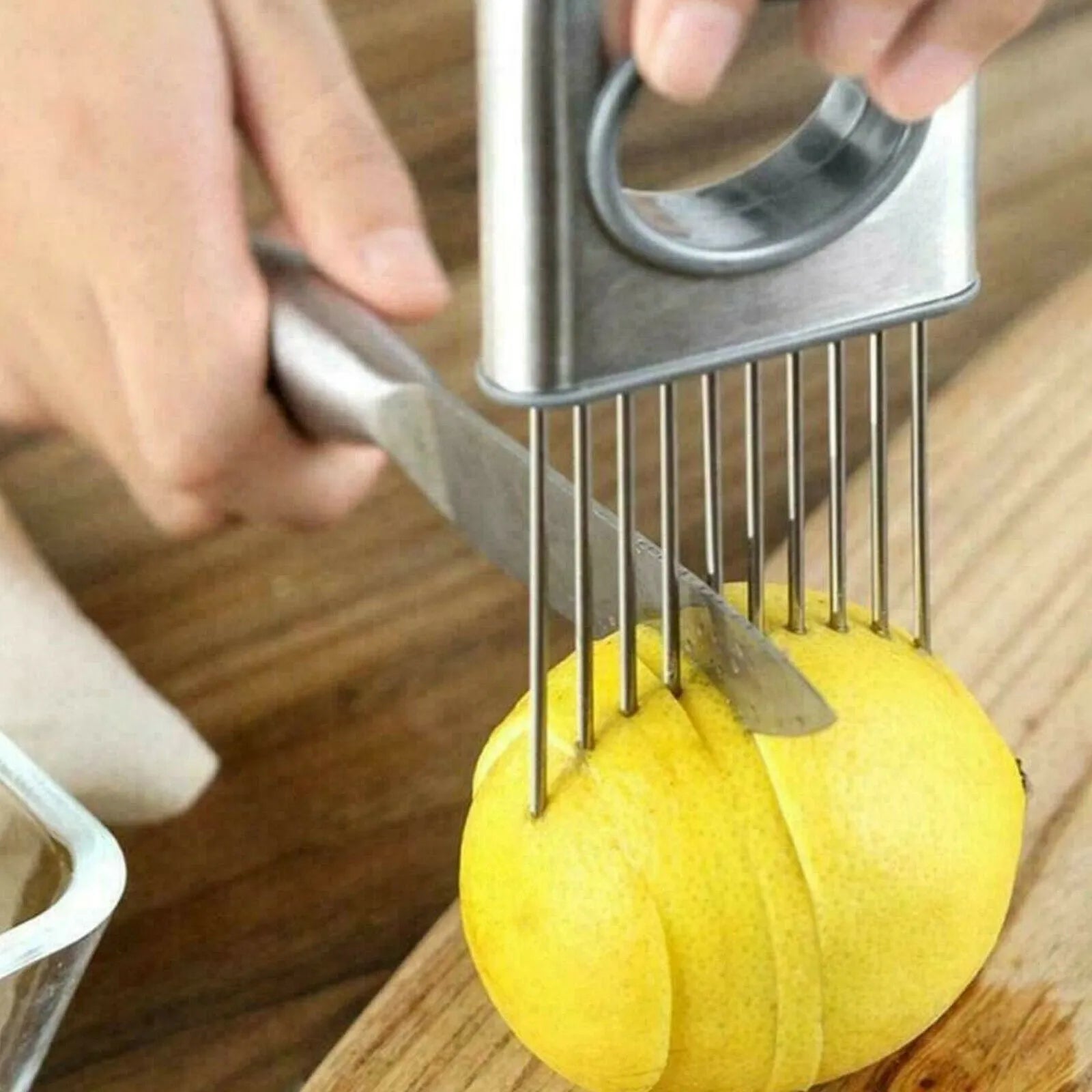Stainless steel onion holder with sharp prongs and finger guard for cutting vegetables