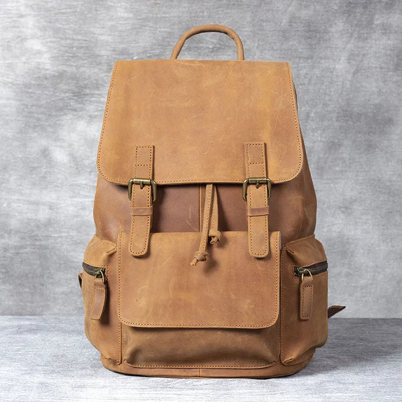 Brown genuine cowhide leather backpack with double shoulder straps and soft handle