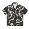 Short sleeve Cuban collar shirt with a printed snake bone and floral pattern in a loose fit.