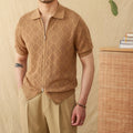 Light brown cotton short sleeve cardigan with a front zipper and lapel collar laid flat.