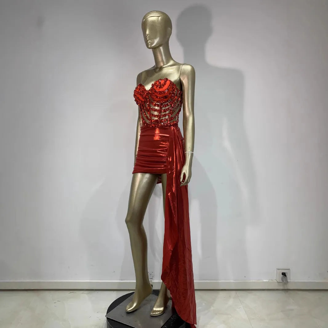 Red female skirt suit with hollow mesh see-through panels, a stage and party costume made from spandex.
