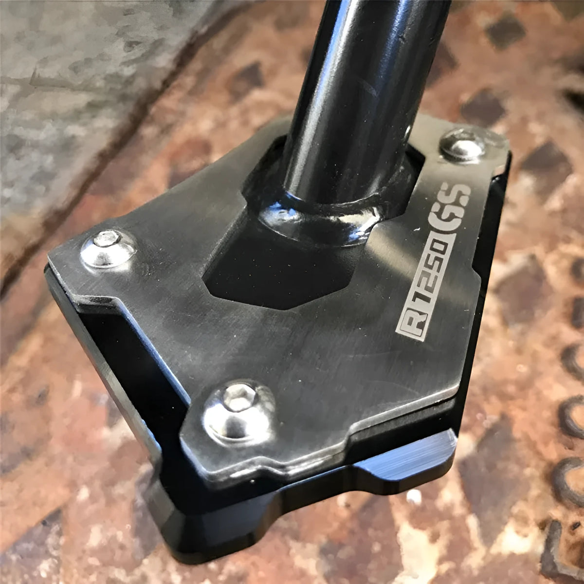 Aluminium alloy motorcycle side stand brace for R1200GS LC in black and silver finish with anti-slip mat