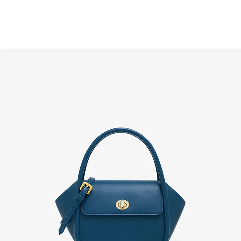 New leather tote cross-body wing bag in top layer cow leather with buckle detail, latch closure, and single shoulder strap