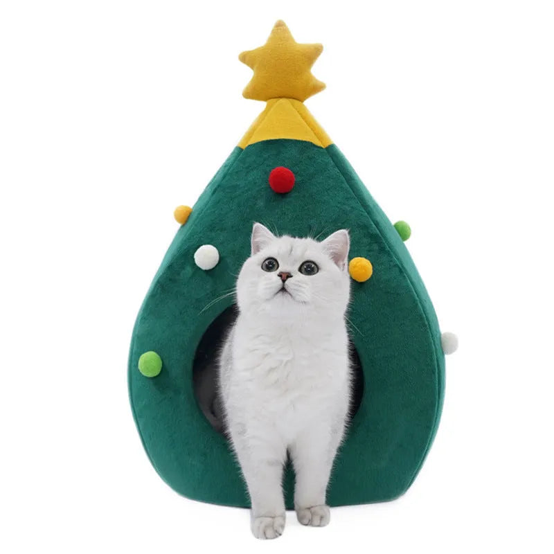 Red Christmas tree-shaped plush cave bed for cats and small dogs on a white background.
