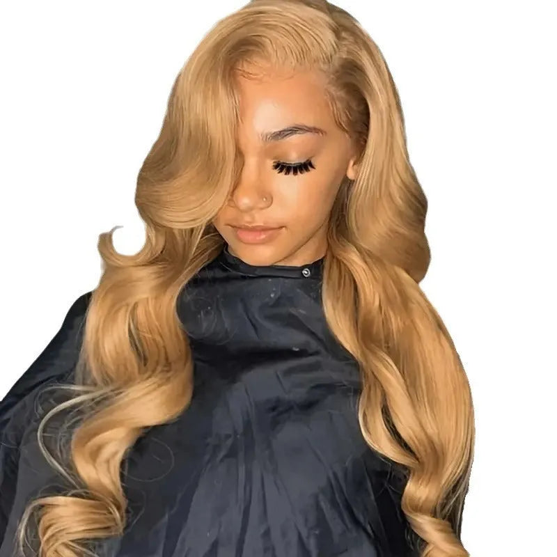 Light brown long synthetic curly wig with big waves and side bangs shown at medium length